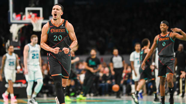 Landry Shamet (20) and Bilal Coulibaly (0) celebrate a made three-pointer during the second half vs. Charlotte Hornets at Capital One Arena. Mandatory Credit: Tommy Gilligan-USA TODAY Sports